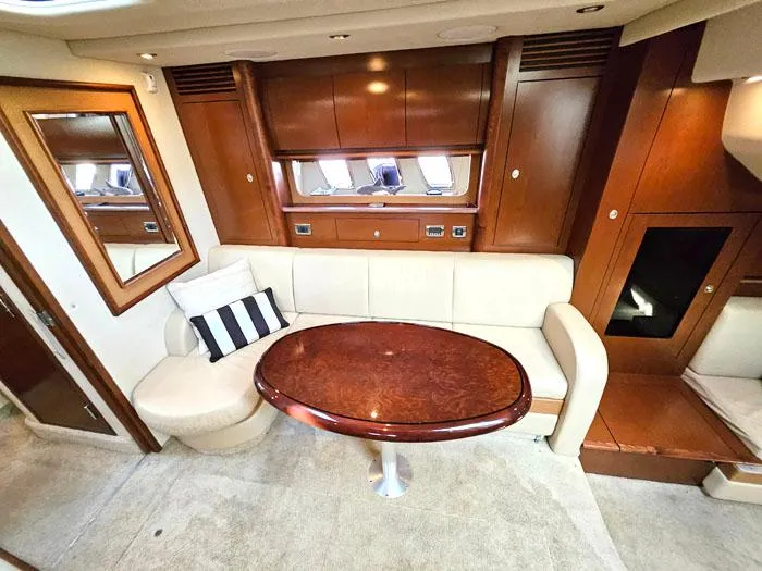 Slide: The Image of Luxurious 2007 Sea Ray 40 Sundancer interior with elegant wood and cream upholstery. - 10