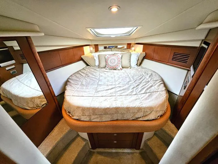 Slide: The Image of Luxurious cabin interior of 2007 Sea Ray 40 Sundancer yacht with cozy bedding. - 14