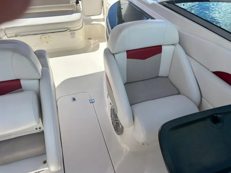 Slide: The Image of 2015 Chaparral 287 SSX boat interior with white and red seating. - 9