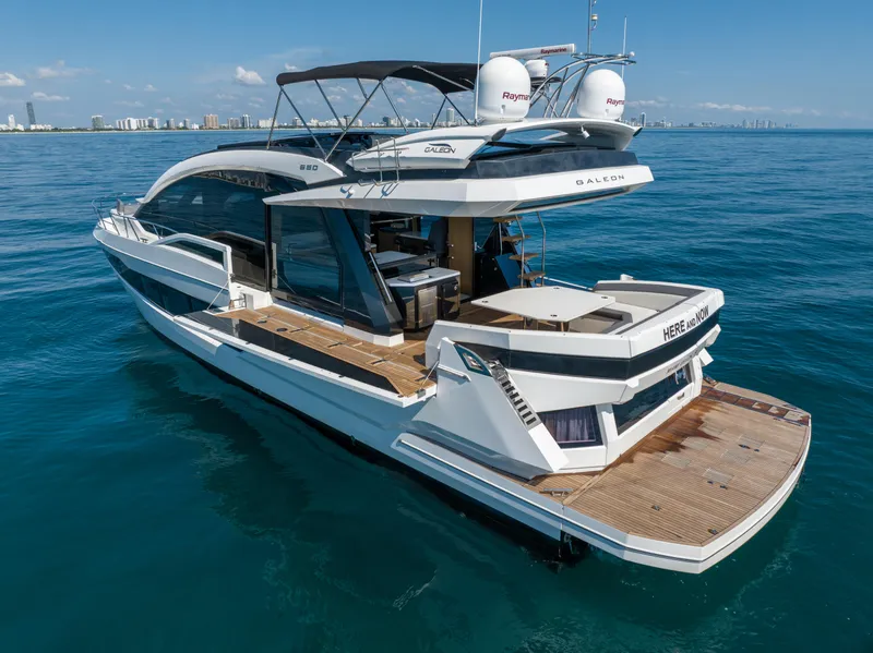 Slide: The Image of 2019 Galeon 650 Sky yacht cruising on open water. - 11