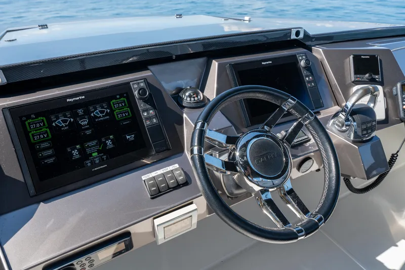 Slide: The Image of Cockpit of 2019 Galeon 650 Sky yacht with advanced navigation controls. - 22