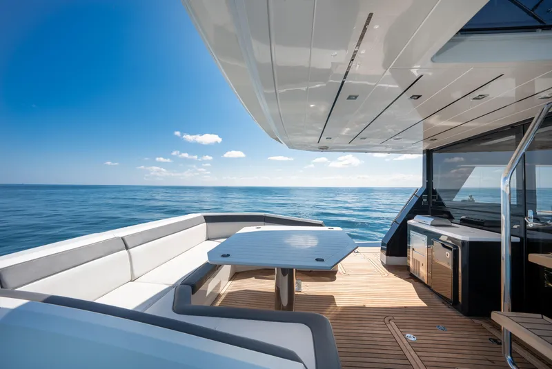 Slide: The Image of Luxurious 2019 Galeon 650 Sky yacht deck with ocean view and modern seating. - 24