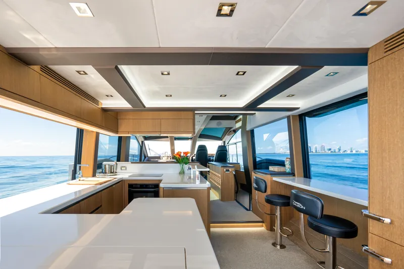 Slide: The Image of Luxurious interior of 2019 Galeon 650 Sky yacht with modern kitchen and ocean view. - 28