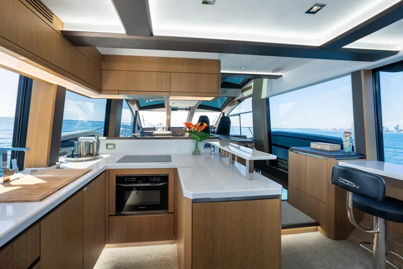 Slide: The Image of Luxurious interior of 2019 Galeon 650 Sky yacht with modern kitchen and ocean view. - 31
