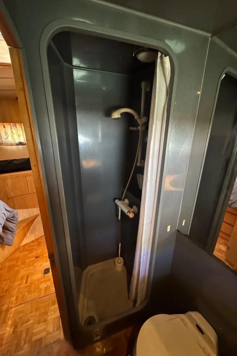 Slide: The Image of Shower area in 1991 Ocean Alexander 46 yacht, featuring compact design and modern fixtures. - 13