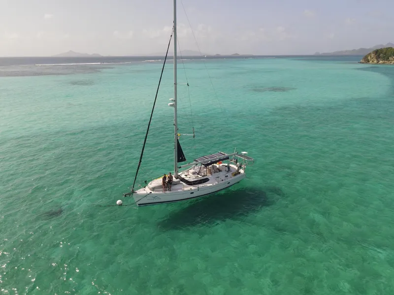 Slide: The Image of Sailboat Hunter 45 CC (2007) on turquoise waters, serene seascape. - 0