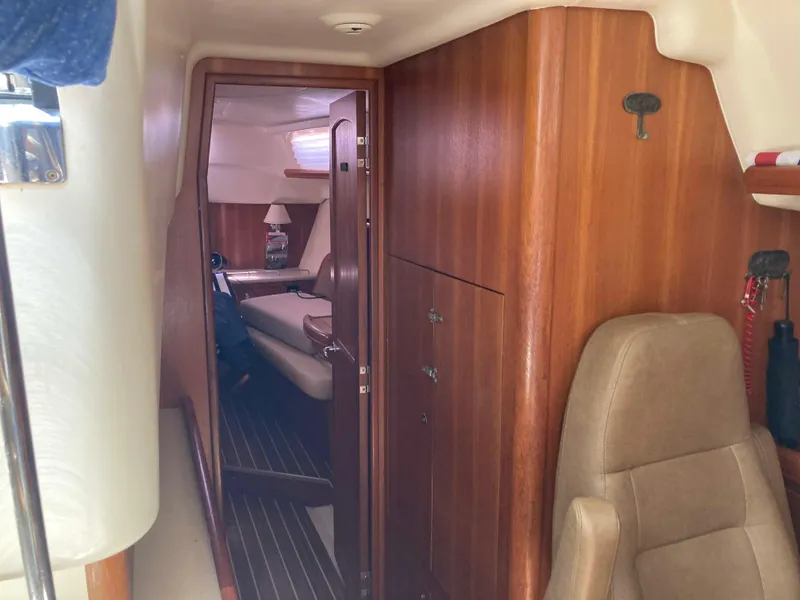 Slide: The Image of Interior of 2007 Hunter 45 CC sailboat with wooden cabinetry and seating. - 18