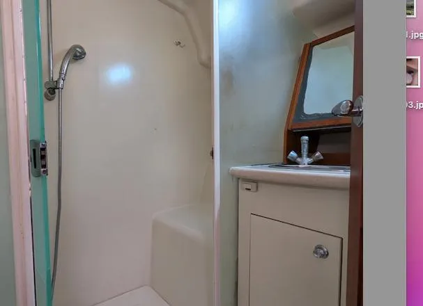 Slide: The Image of 2007 Hunter 45 CC yacht bathroom with shower and vanity. - 21