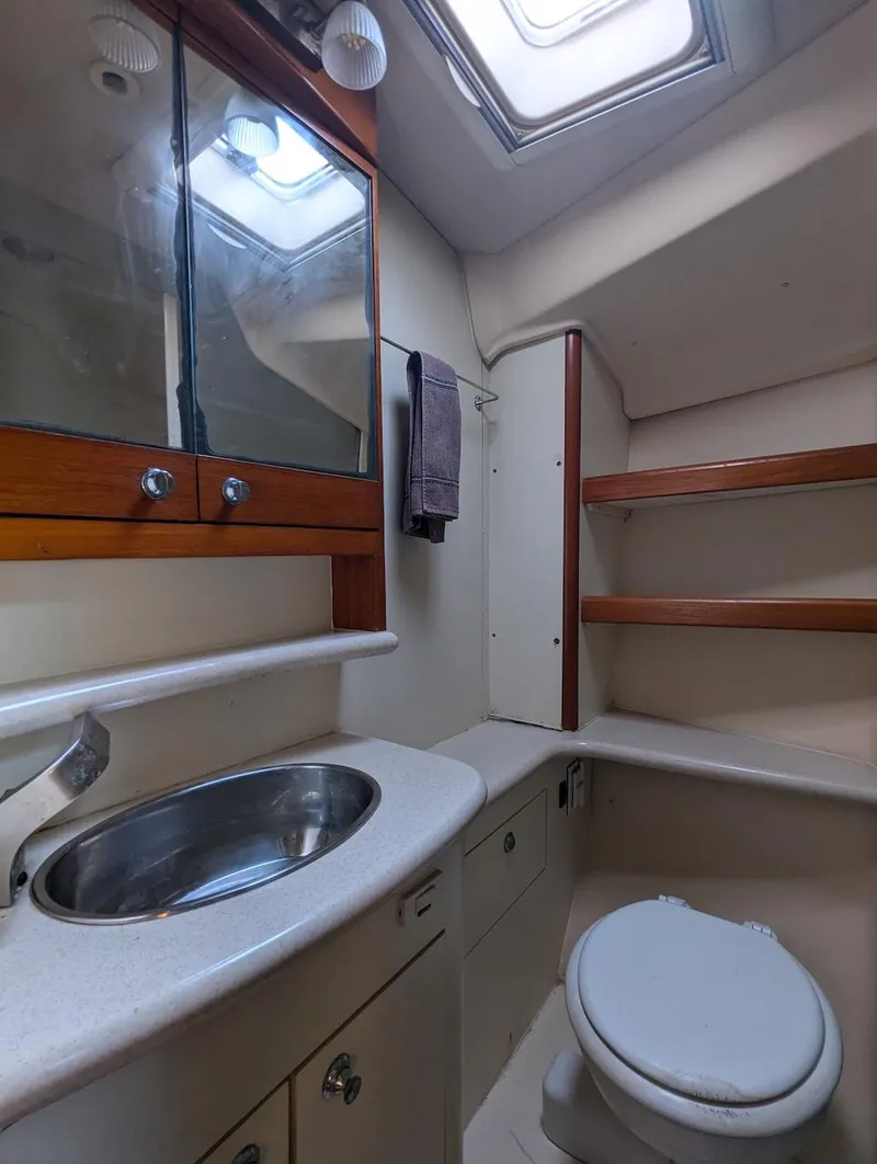Slide: The Image of 2007 Hunter 45 CC yacht bathroom with sink, mirror, and toilet. - 22