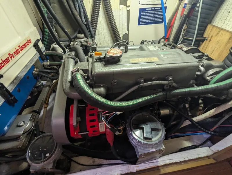 Slide: The Image of Engine compartment of a 2007 Hunter 45 CC sailboat, showing detailed mechanical components. - 25