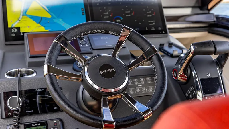 Slide: The Image of Steering wheel and dashboard of 2025 Technohull Omega 47 boat. - 12