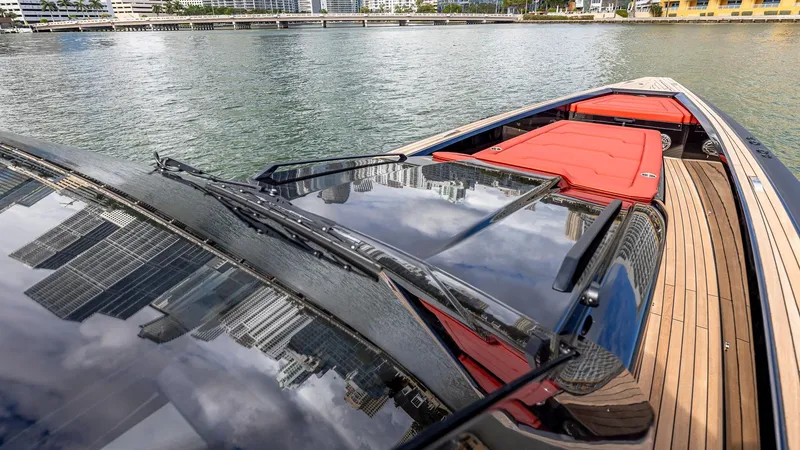Slide: The Image of 2025 Technohull Omega 47 luxury boat with sleek design on calm waters. - 14