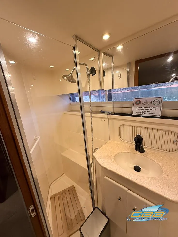 Slide: The Image of 1998 Carver 405 Aft Cabin bathroom with shower and sink. - 34