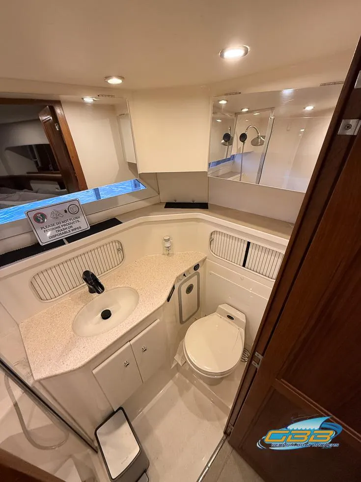 Slide: The Image of 1998 Carver 405 Aft Cabin bathroom with modern fixtures and ample lighting. - 35