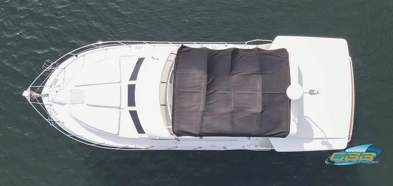 Slide: The Image of Aerial view of 1998 Carver 405 Aft Cabin yacht on water. - 25