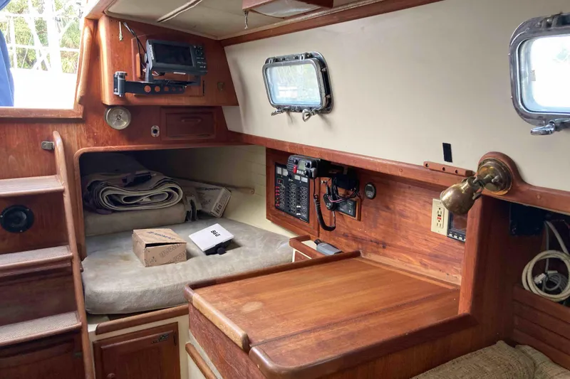 Slide: The Image of 1994 Pacific Seacraft 37 interior with navigation equipment and wooden cabinetry. - 11