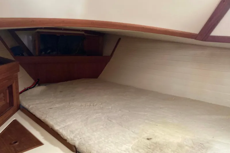 Slide: The Image of Interior cabin of 1994 Pacific Seacraft 37 sailboat with wooden trim and cozy berth. - 15