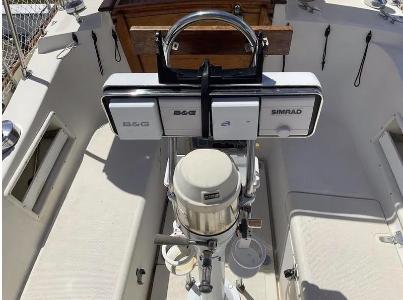 Slide: The Image of 1994 Pacific Seacraft 37 Scheel Keel cockpit with navigation equipment and steering wheel. - 6