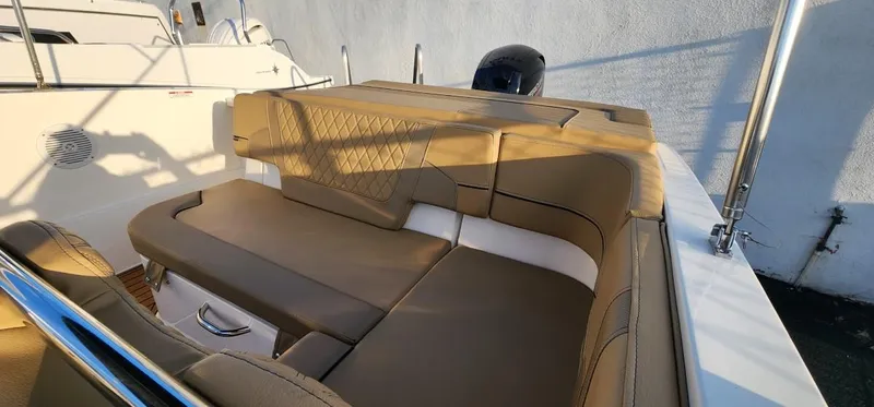 Slide: The Image of 2024 Bayliner VR6 Bowrider OB with tan seating and sleek design. - 13