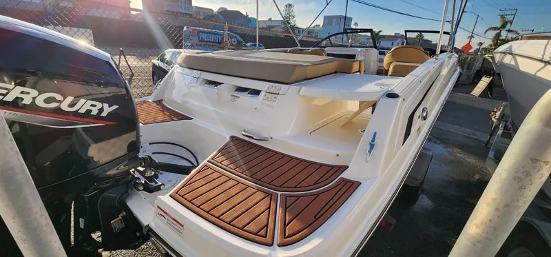 Slide: The Image of 2024 Bayliner VR6 Bowrider OB with Mercury outboard, featuring spacious deck and seating. - 21