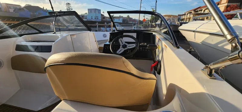 Slide: The Image of 2024 Bayliner VR6 Bowrider OB interior with steering wheel and seating. - 27