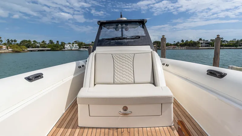 Slide: The Image of 2025 Technohull EXPLORER 40S luxury boat interior with white seating and wooden deck. - 4