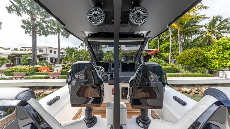 Slide: The Image of 2025 Technohull EXPLORER 40S luxury boat interior with modern seating and lush waterfront view. - 6