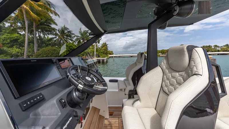 Slide: The Image of Luxurious 2025 Technohull EXPLORER 40S cockpit with plush seating and advanced controls. - 7
