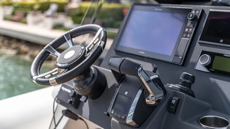 Slide: The Image of Technohull EXPLORER 40S 2025 dashboard with steering wheel and navigation display. - 8