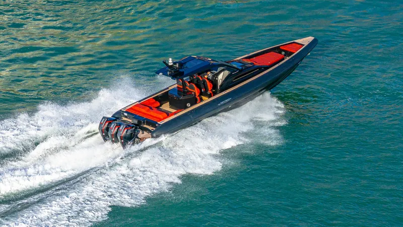 Slide: The Image of 2025 Technohull Omega 47 speedboat cruising on open water. - 1
