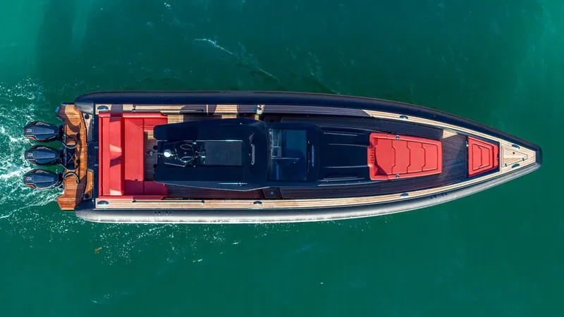 Slide: The Image of Aerial view of 2025 Technohull Omega 47 luxury speedboat on turquoise water. - 3