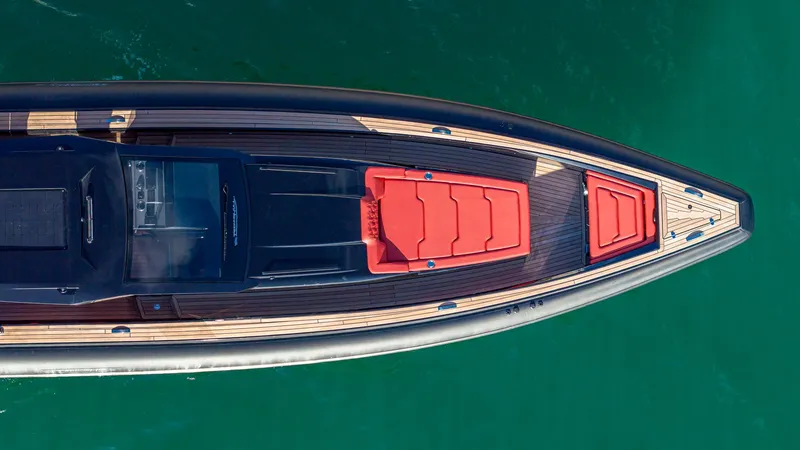Slide: The Image of Aerial view of 2025 Technohull Omega 47 yacht with sleek design and red seating. - 4