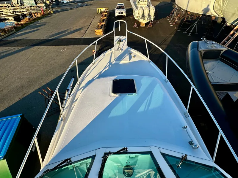 Slide: The Image of 2000 Mainship Pilot 30 Sedan boat on dry dock, viewed from above. - 4