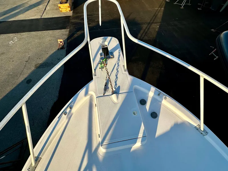 Slide: The Image of Bow of 2000 Mainship Pilot 30 Sedan with anchor and railing in sunlight. - 5