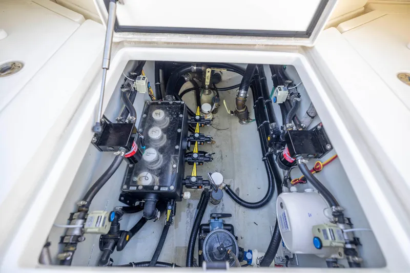 Slide: The Image of 2022 SeaVee 390Z engine compartment with advanced mechanical systems and wiring. - 11