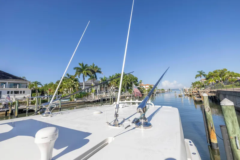 Slide: The Image of 2022 SeaVee 390Z boat docked in sunny marina with palm trees. - 16