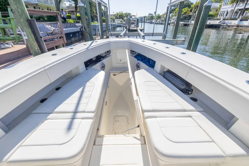 Slide: The Image of 2022 SeaVee 390Z boat interior with white seating and waterfront view. - 18