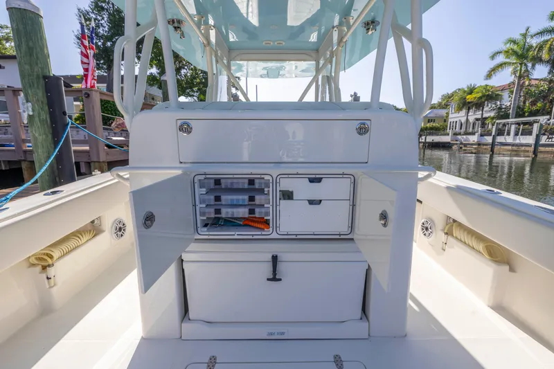Slide: The Image of 2022 SeaVee 390Z boat interior with storage compartments and fishing gear. - 27