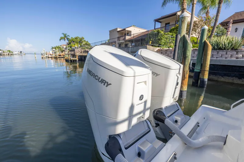 Slide: The Image of 2022 SeaVee 390Z boat with twin Mercury outboard engines docked by waterfront homes. - 29