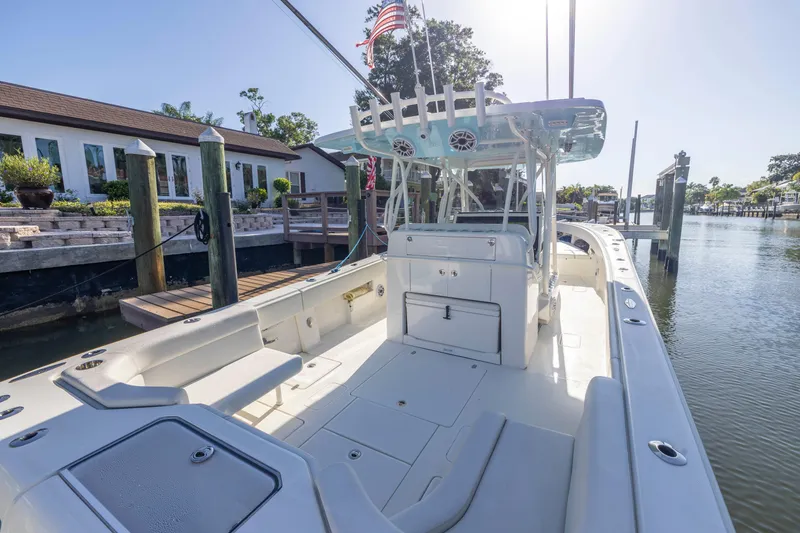 Slide: The Image of 2022 SeaVee 390Z boat docked, showcasing spacious deck and modern design. - 30