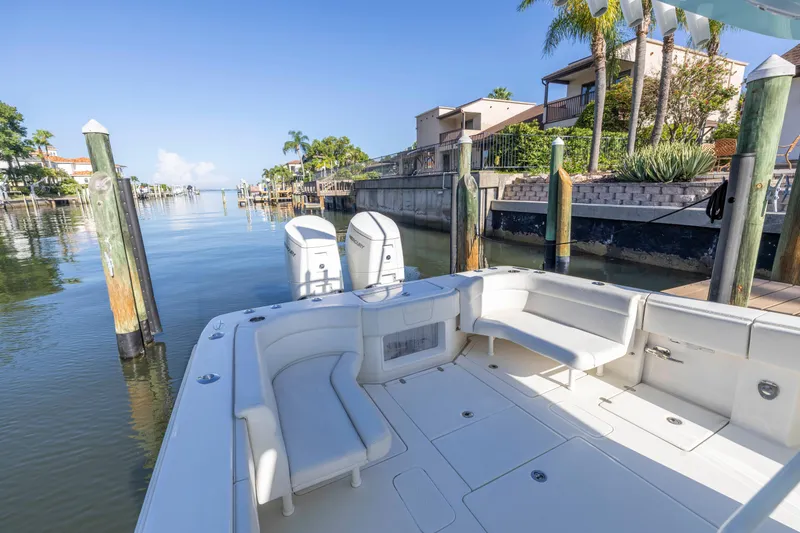 Slide: The Image of 2022 SeaVee 390Z boat docked in a scenic waterfront setting. - 33