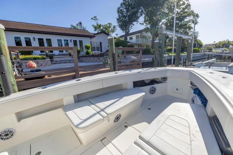 Slide: The Image of 2022 SeaVee 390Z boat docked near waterfront homes. - 41