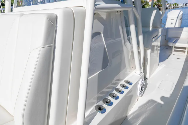 Slide: The Image of 2022 SeaVee 390Z boat interior with sleek white seating and control panel. - 7