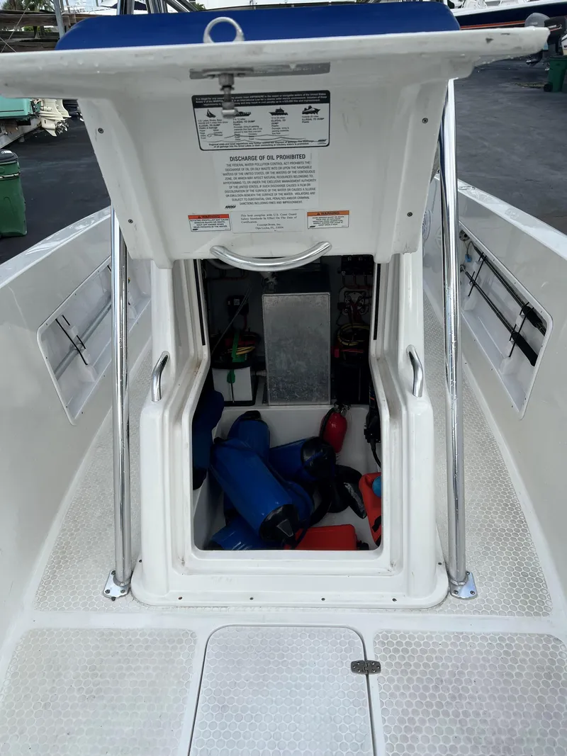 Slide: The Image of Open hatch of 2016 Concept 27' CC boat showing interior storage area. - 11