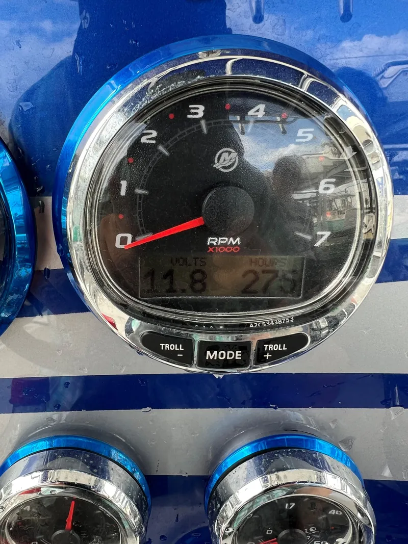 Slide: The Image of Close-up of a 2016 Concept 27' CC boat tachometer displaying RPM, volts, and hours. - 12