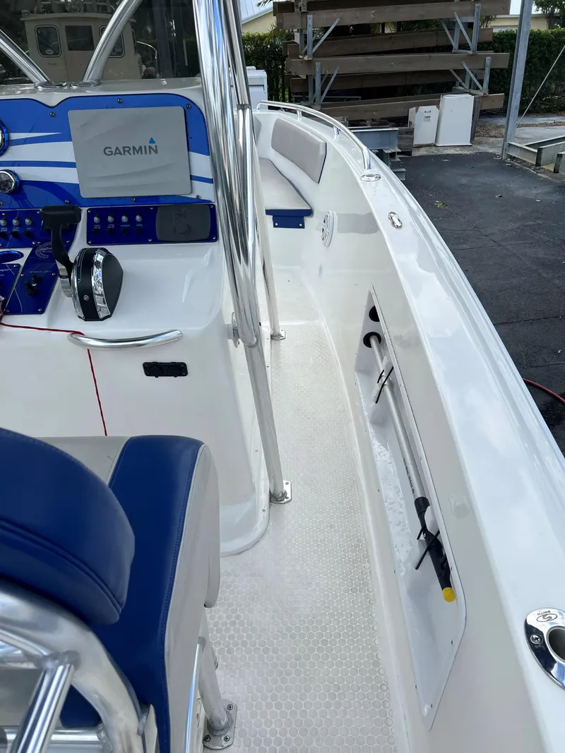 Slide: The Image of 2016 Concept 27' CC boat interior with Garmin navigation system and blue seating. - 13
