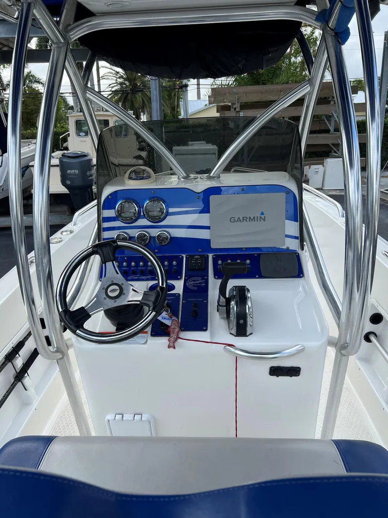 Slide: The Image of 2016 Concept 27' CC boat dashboard with Garmin navigation system and steering wheel. - 2