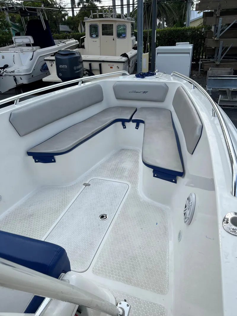 Slide: The Image of 2016 Concept 27' CC boat interior with cushioned seating and clean deck. - 4