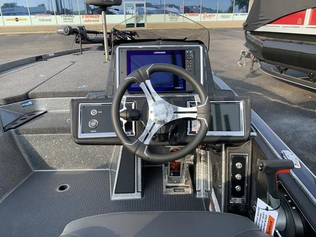 Slide: The Image of 2024 Ranger Z520R boat cockpit with steering wheel and navigation display. - 5