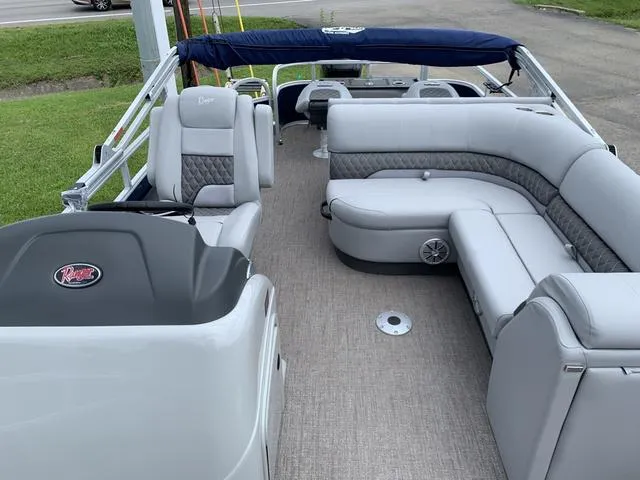 Slide: The Image of 2023 Ranger 220F pontoon boat with spacious seating and modern design. - 3